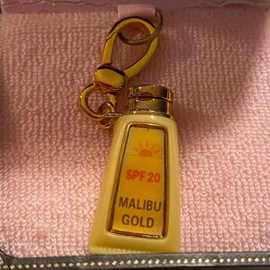 NWT and box Juicy Couture Mabilu Tan sunscreen Charm #